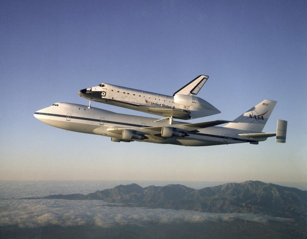 The Space Shuttle Atlantis is carried on the back of a 747. Credit: NASA