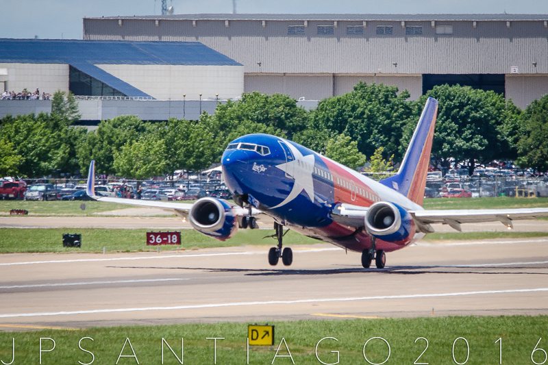 Lift off from 13R at Dallas Love Field. Note all the Southwest employees in the parking lot and open deck of the airline's headquarters building.