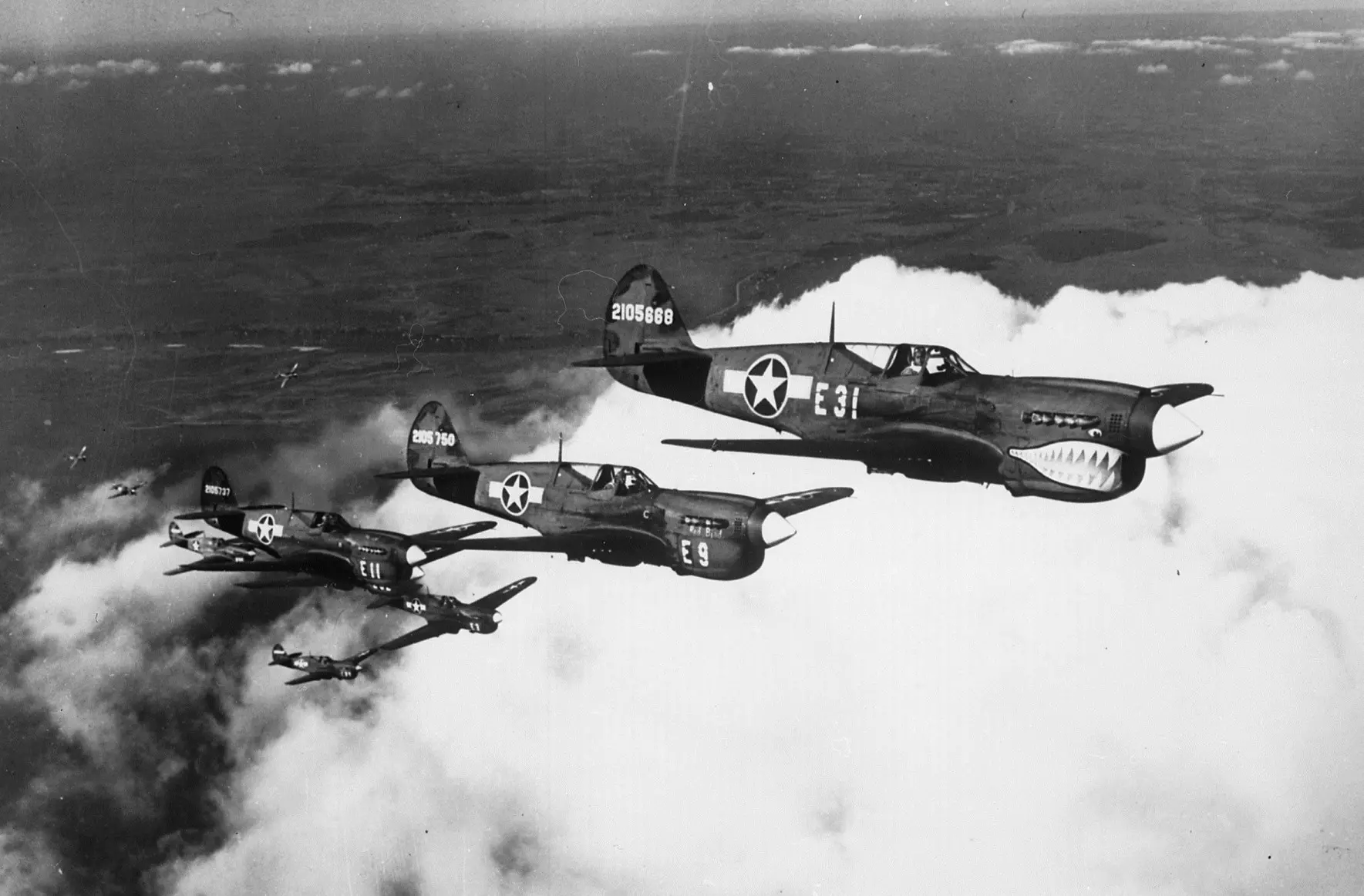 Negro pilots in one of the flight formations which will soon carry them over enemy territory. Here they are flying the NARA 535964