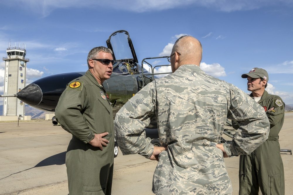 Lt. Col. Ron King, left, and Jim Harkins, both pilots from the 82nd Aerial Targets Squadron, Detachment 1, Holloman Air Force Base, New Mexico, talk with Col. Dana Pelletier, 75th Mission Support Group commander, during a QF-4 Aerial Target aircraft static display at Hill AFB, Oct. 25. (U.S. Air Force photo by Paul Holcomb)