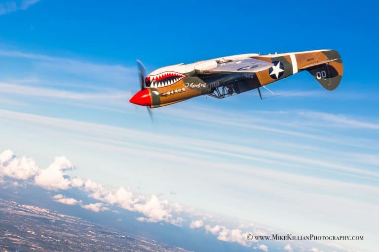 Watch a P-51 Fly Formation Loops with a P-40 for a Photo Shoot