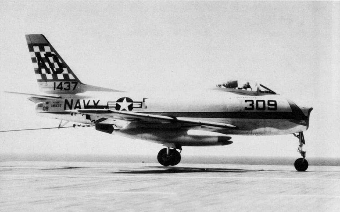 FJ 3 Fury of VF 73 landing aboard USS Randolph CVA 15 circa in 1957