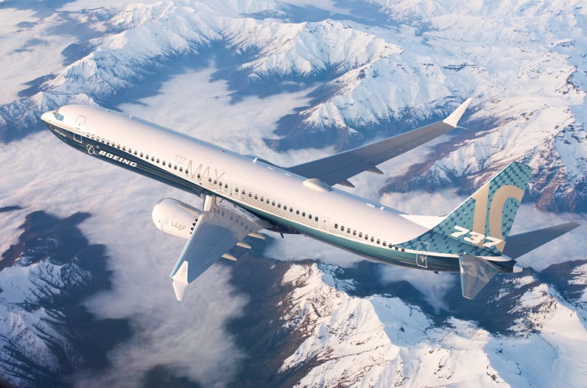 boeing 737 max 10 flying over snowy mountains
