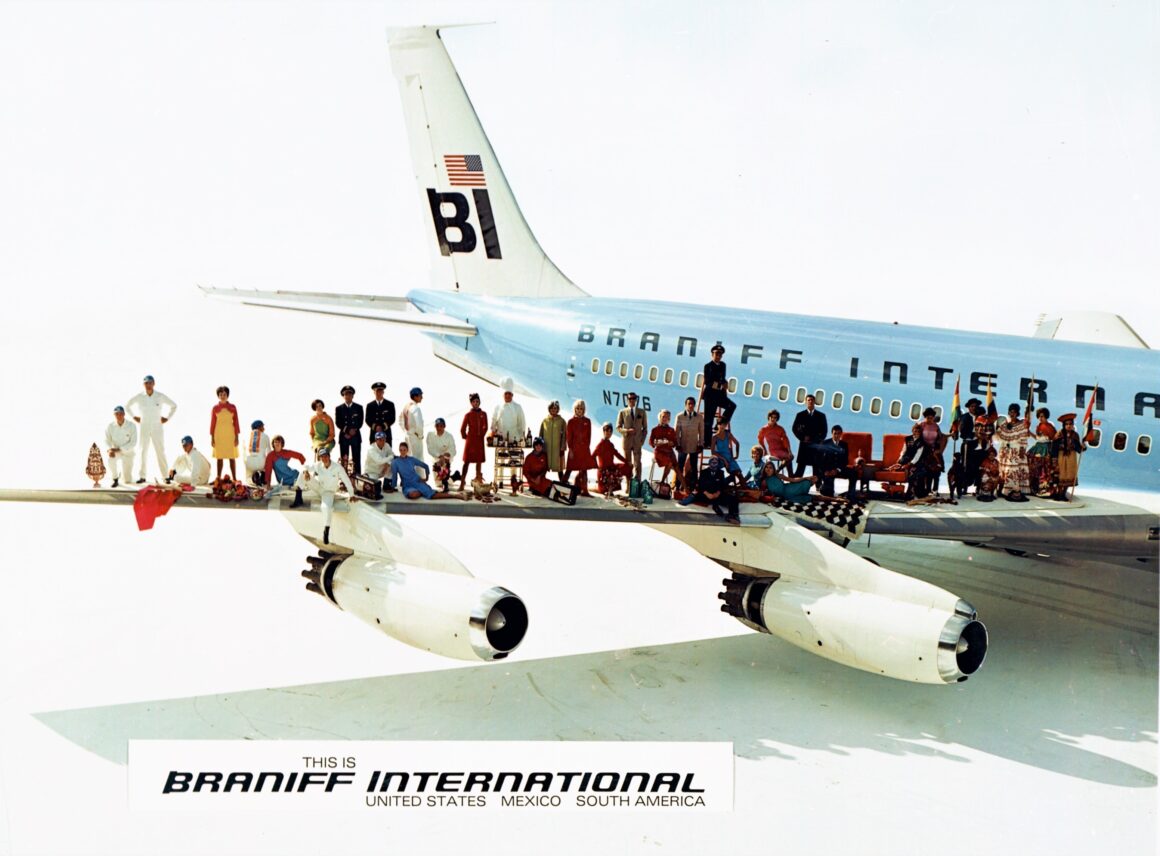 A BRANIFF ADVERTISEMENT INTRODUCING THE 'END OF THE PLAIN PLANE'. THIS PHOTO WAS TAKEN AT DALLAS LOVE FIELD IN THE SUMMER OF 1965, SEVERAL MONTHS PRIOR TO THE OFFICIAL UNVEILING OF THE COMPANY'S NEW LOOK. PHOTO COPYRIGHT BRANIFF AIRWAYS, INC. ALL RIGHTS RESERVED. 