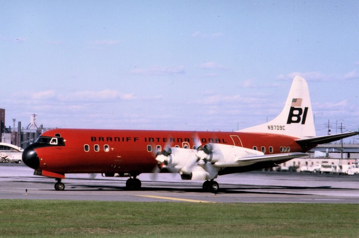 Electra N9709C displays a red paint scheme in this photo taken at Kansas City (MKC). Photo copyright Braniff Airways, Inc. All rights reserved.