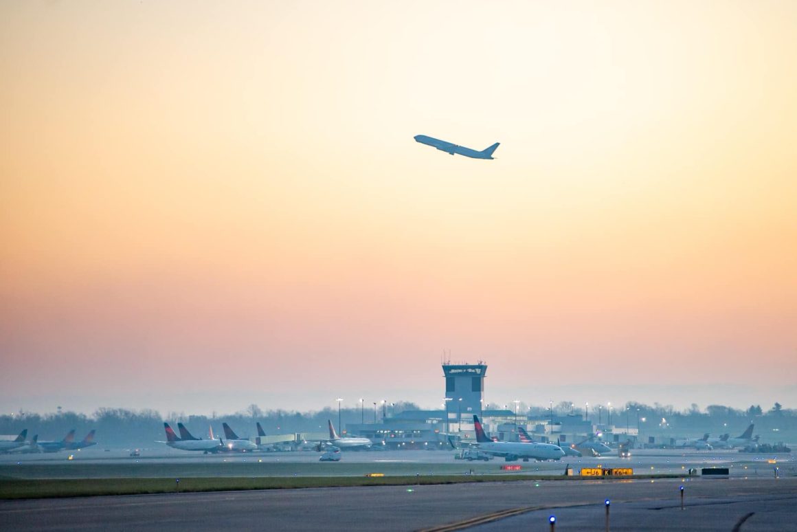 A plane silhouetted against the rising sun at Cincinnati/Northern Kentucky International Airport