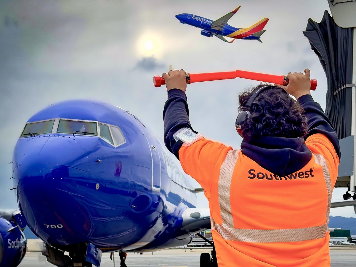Ramp personnel direct a Southwest Boeing 737-700