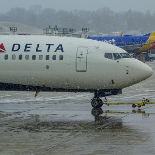 A Delta Boeing 737-900 and a Southwest Boeing 737-700 at General Mitchell International Airport (KMKE)