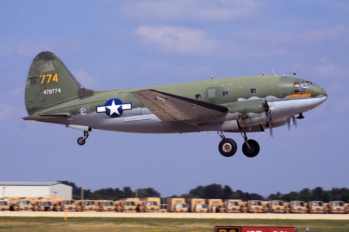 N78774 Curtiss C-46 Commando. "Tinker Bell" Commemorative AirForce getting airborne at Oshkosh (cc 2.0) by Paul Nelhams. N78774 Curtiss C-46 Commando. "Tinker Bell" Commemorative AirForce getting airborne at Oshkosh (cc 2.0) by Paul Nelhams.