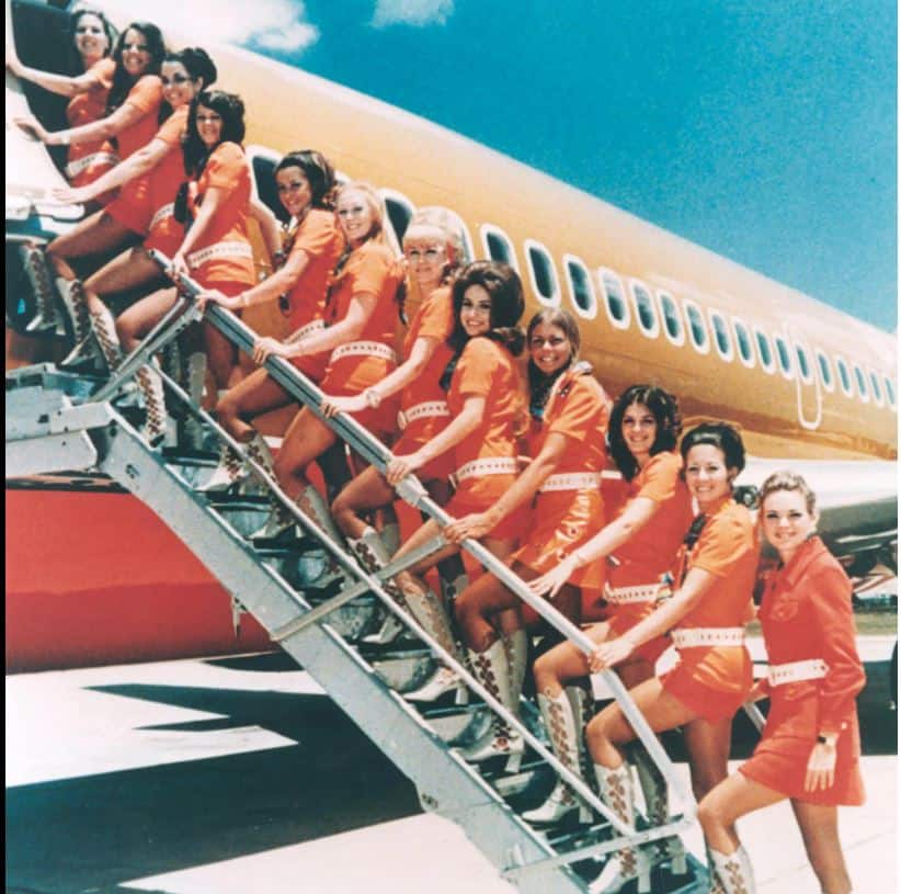 Hire For Attitude. Train For Aptitude. 2 Original Southwest Airlines Flight Attendants. Image: Southwest Airlines