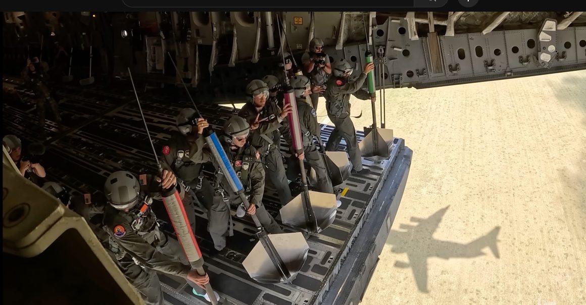 Dude Perfect Guys Drop Darts, Basketballs from C-17 1 Dude Perfect prepping to drop darts from a dartboard. Image: Dude Perfect Video screenshot.