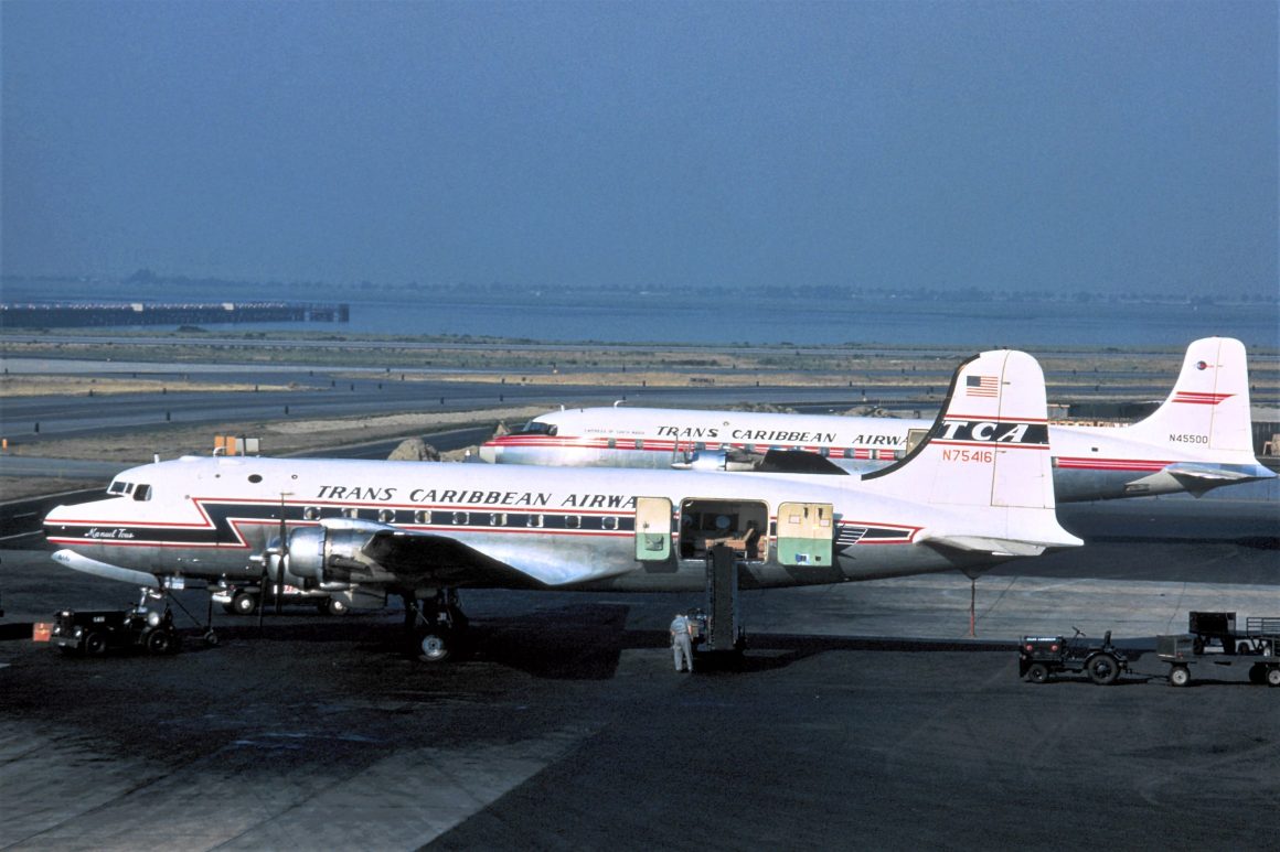 Trans Caribbean DC-4 N75416 shares the ramp at New York (IDLEWILD) with DC-6A N45500. PHOTO: PAUL ZOGG COLLECTION