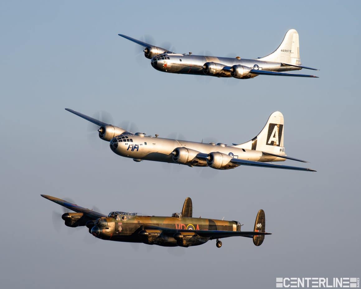 Two B-29s, Doc and Fifi, along with a Lancaster form up for a perfect air to air formation photo.