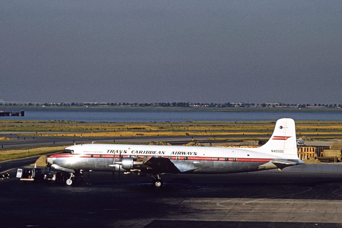 DC-6A N45500 was purchased from Canadian Pacific Airlines and still wears that company's basic livery with Trans Caribbean titles applied. Photo taken at New York (Idlewild) in 1959 by Mel Lawrence.