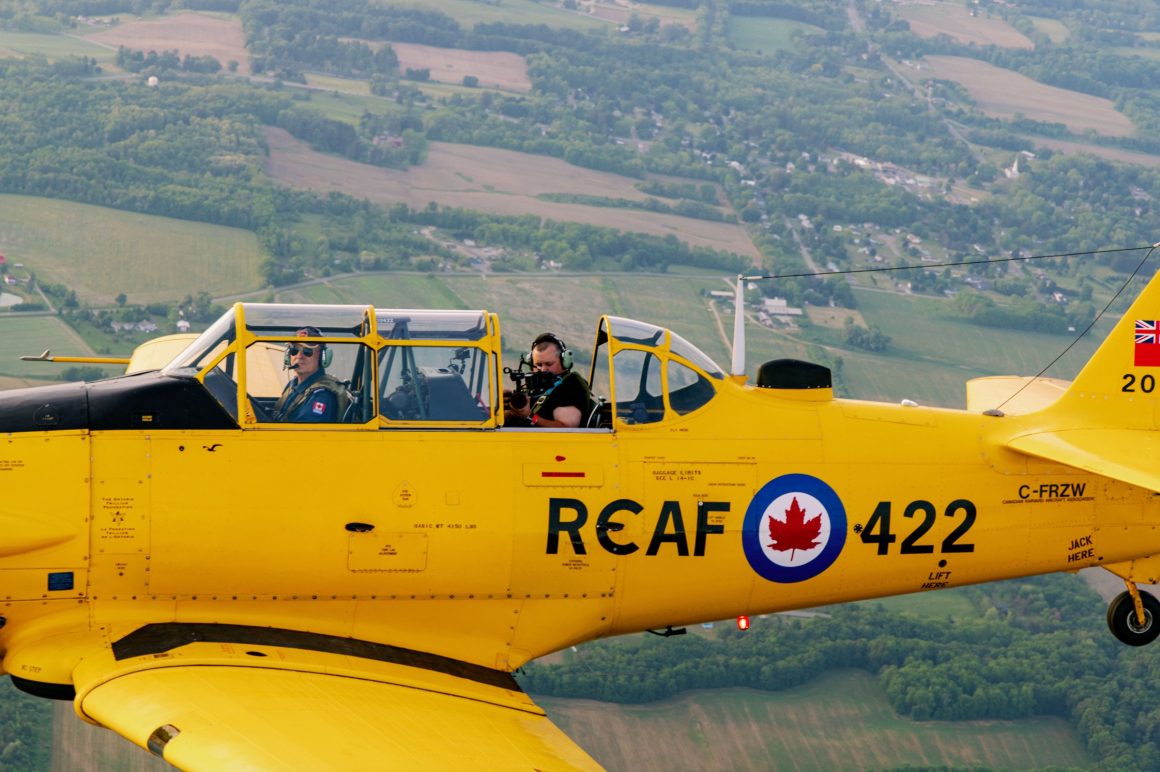 Kyle Newsom conducts open cockpit air to air photography.