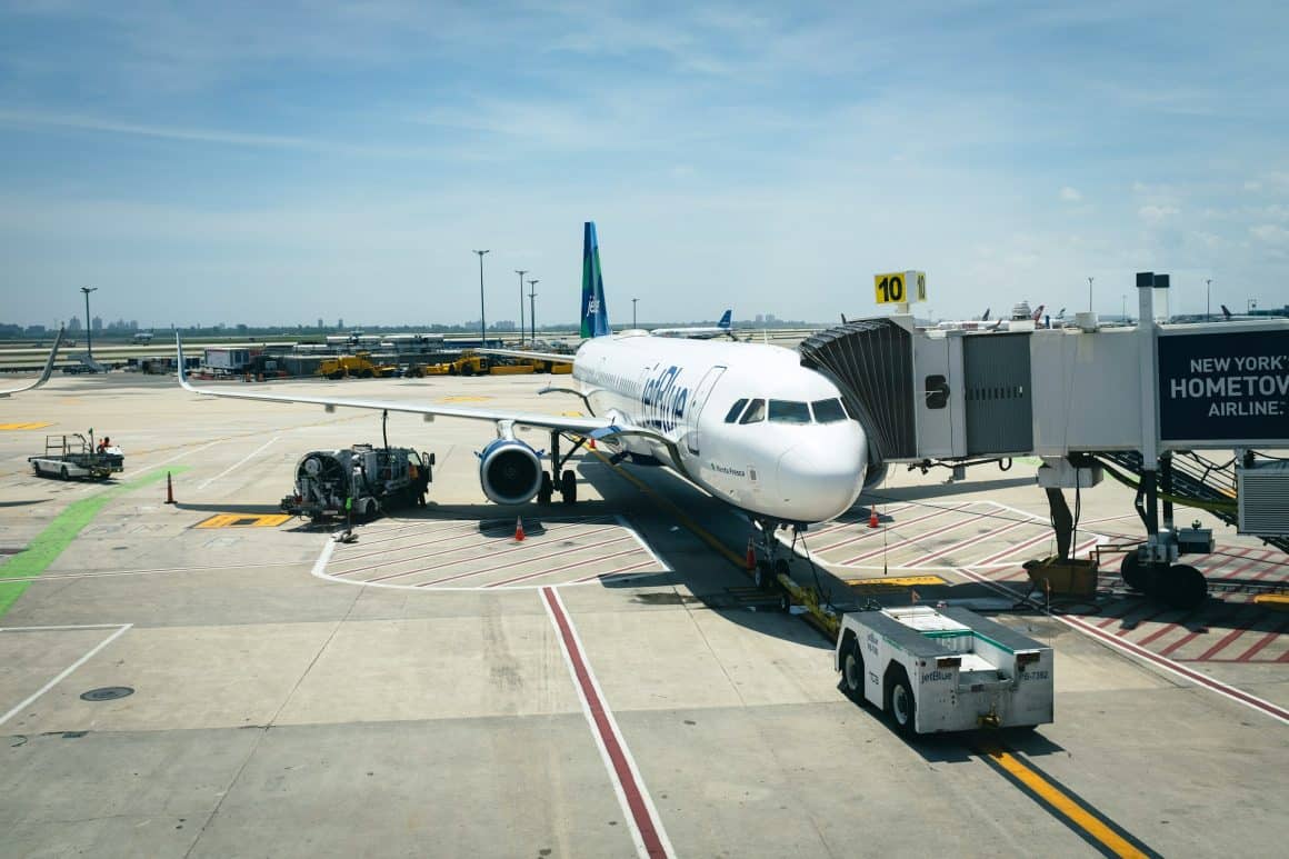 A JetBlue aircraft parked at a gate at JFK. A United and JetBlue partnership could open coveted slots for United at JFK.