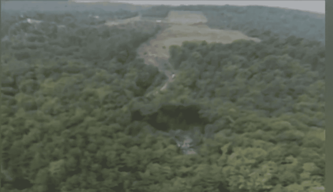 Crater on the hillside from the impact of USAir Flight 427