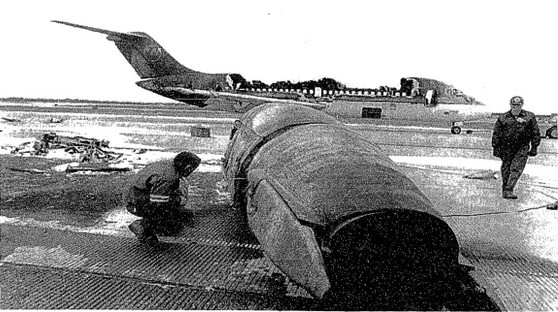 Northwest Flight 1482 and Flight 299: A Collision in the Fog That Never Should Have Happened 6 An investigator examines Engine Number Two, which was ripped off of Northwest Flight 1482
