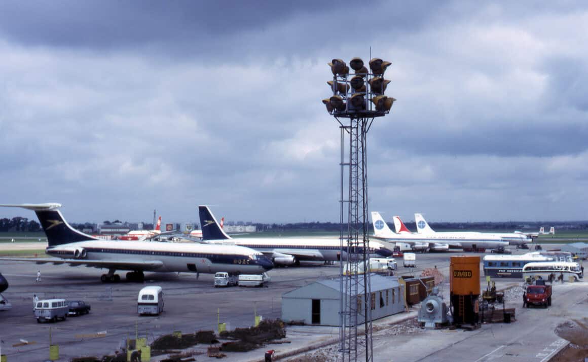 London Heathrow Airport (LHR) in 1965, featuring early long-range jet airliners such as the BOAC Vickers VC-10, BOAC Boeing 707, along with Pan Am and Air India 707s