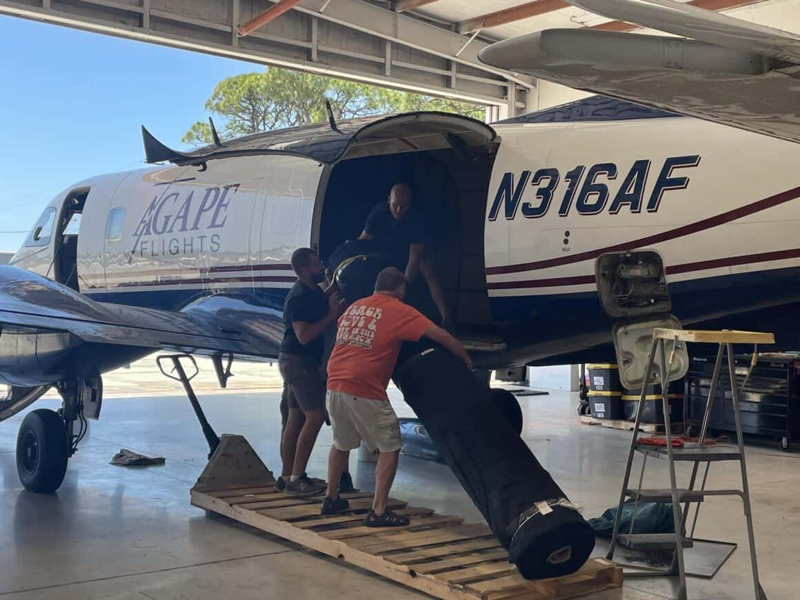 Loading Agape Flights' Embraer 110 