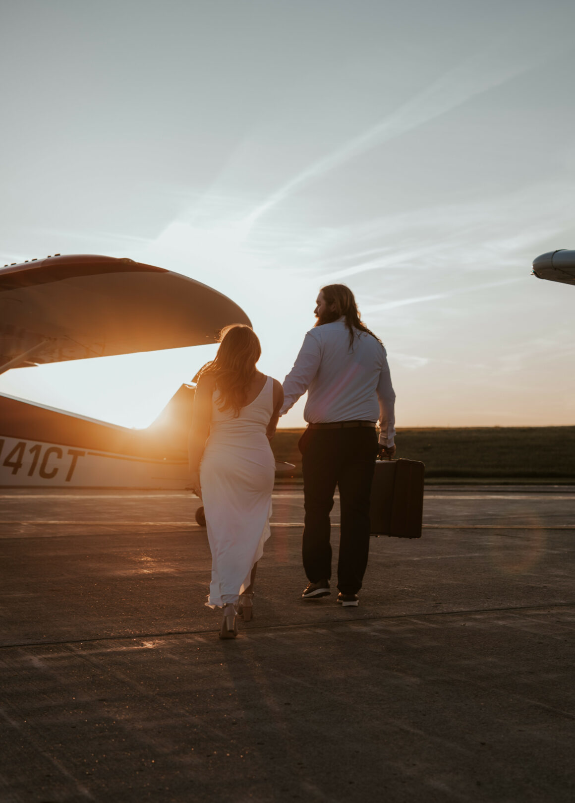 Will and Lydia McDermott posing on the ramp at YNG for their airport photo shoot