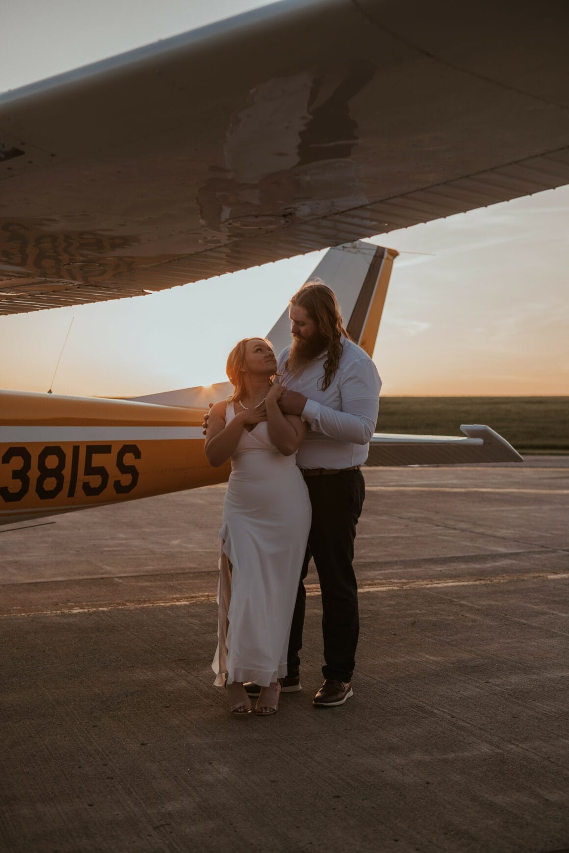 Will and Lydia McDermott posing on the ramp at YNG for their airport photo shoot