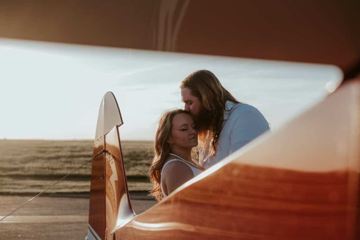 Will and Lydia McDermott posing on the ramp at YNG for their airport photo shoot
