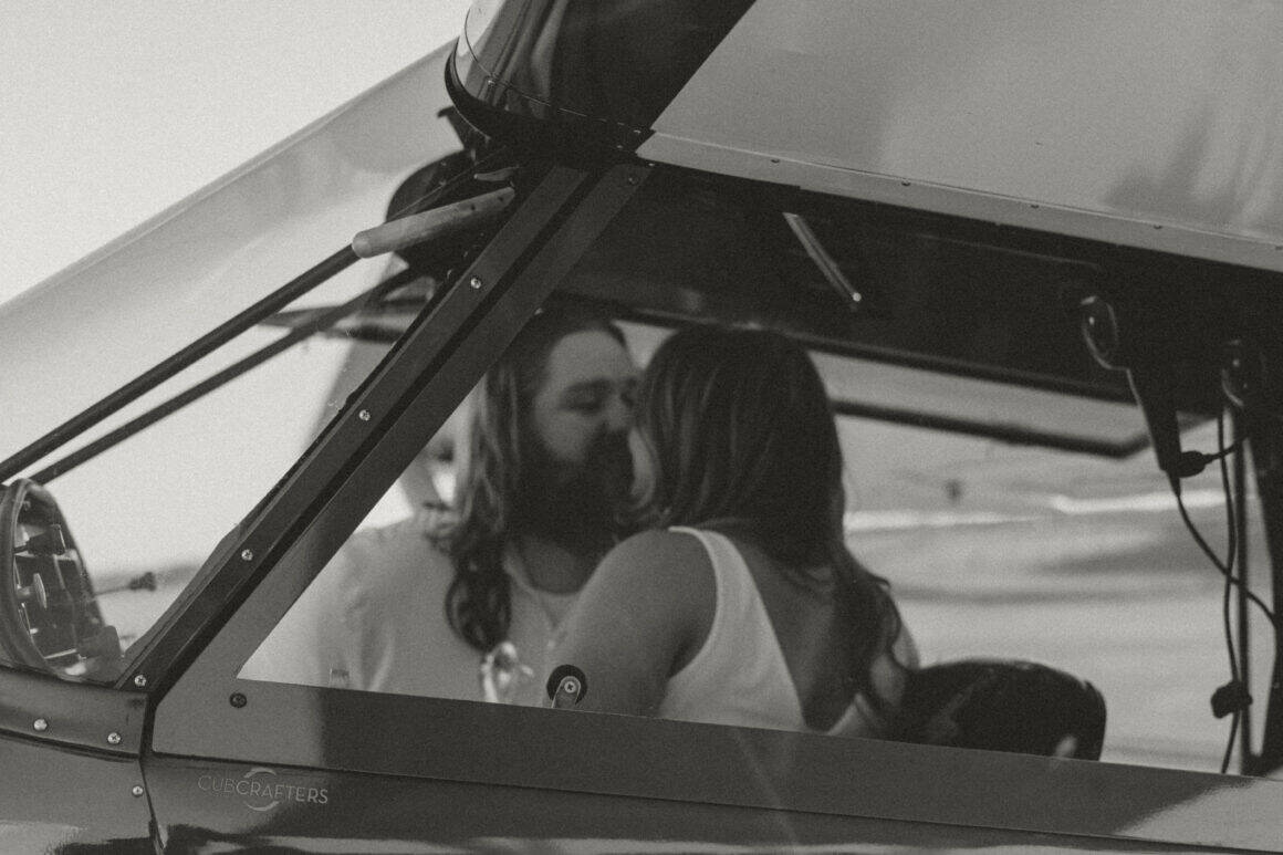 Will and Lydia McDermott posing on the ramp at YNG for their airport photo shoot