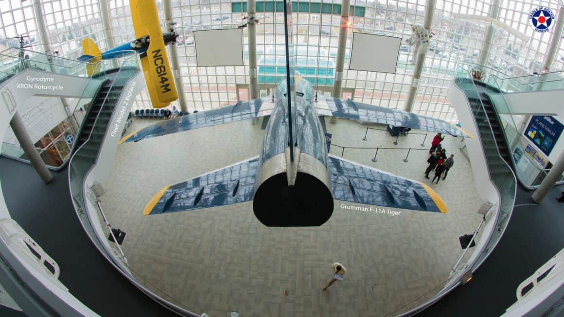 Panoramic view of the atrium with rear view of Grumman F-11A Tiger and Fleet Model 2 Biplane.
