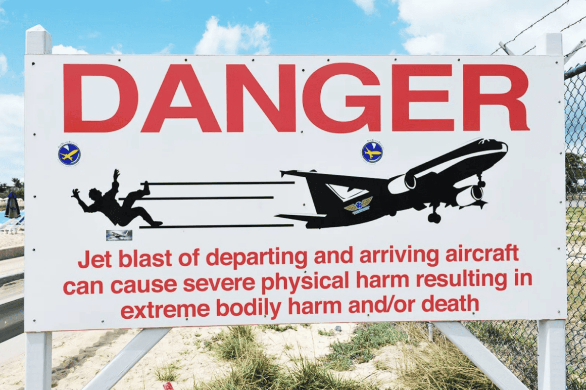 A jet blast warning sign at Maho Beach
